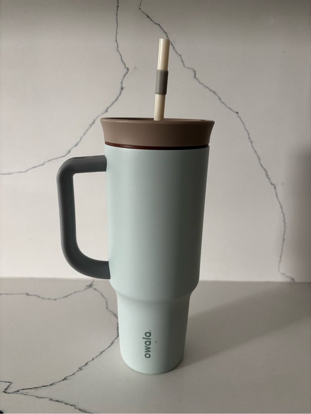 Owala light blue Travel Tumbler with Brown Lid